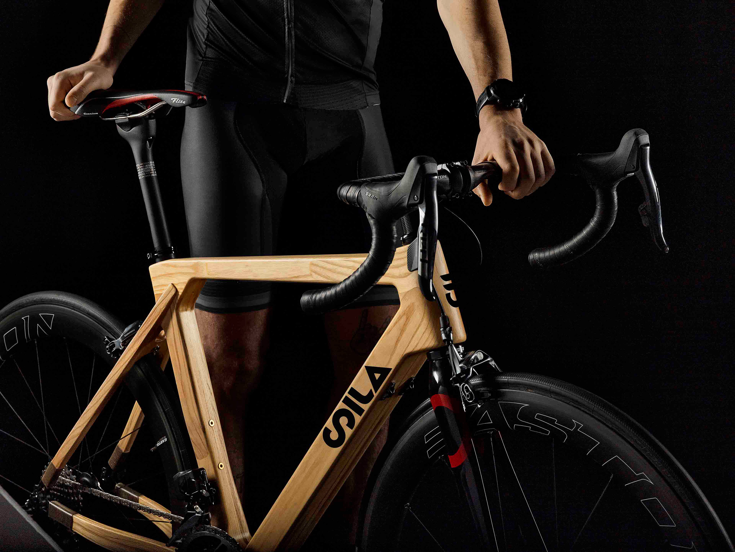 SILA wooden road bike with a cycling enthusiast
